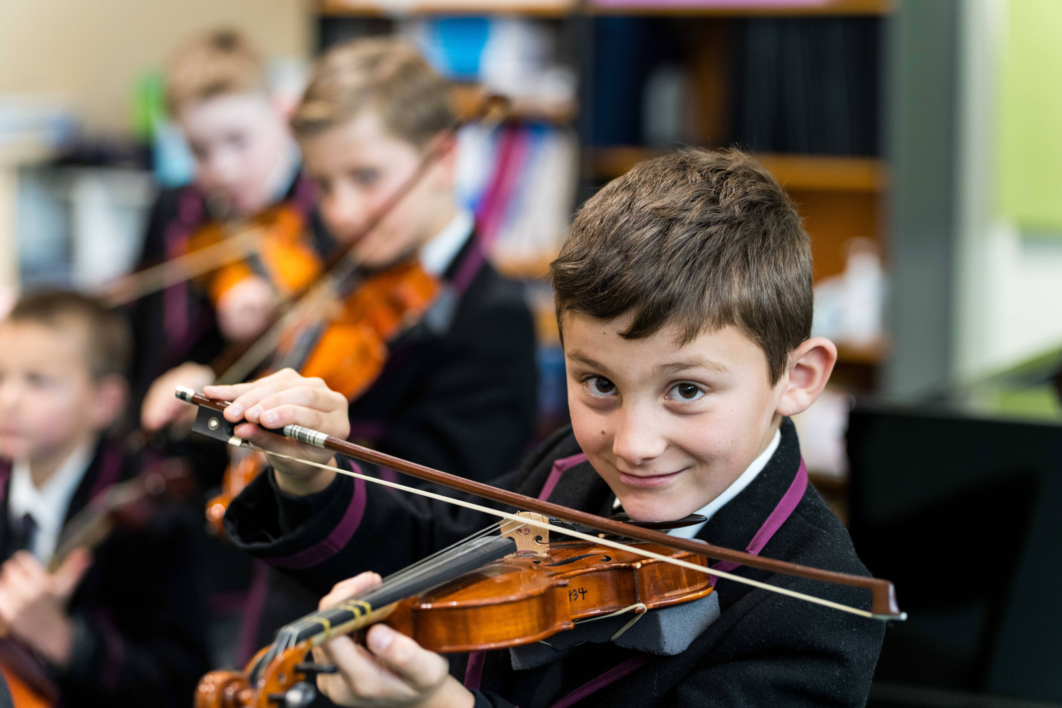 Junior School students playing violins. Photo: Alastair Bett.